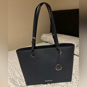Michael Kors navy blue handbag that is in good condition